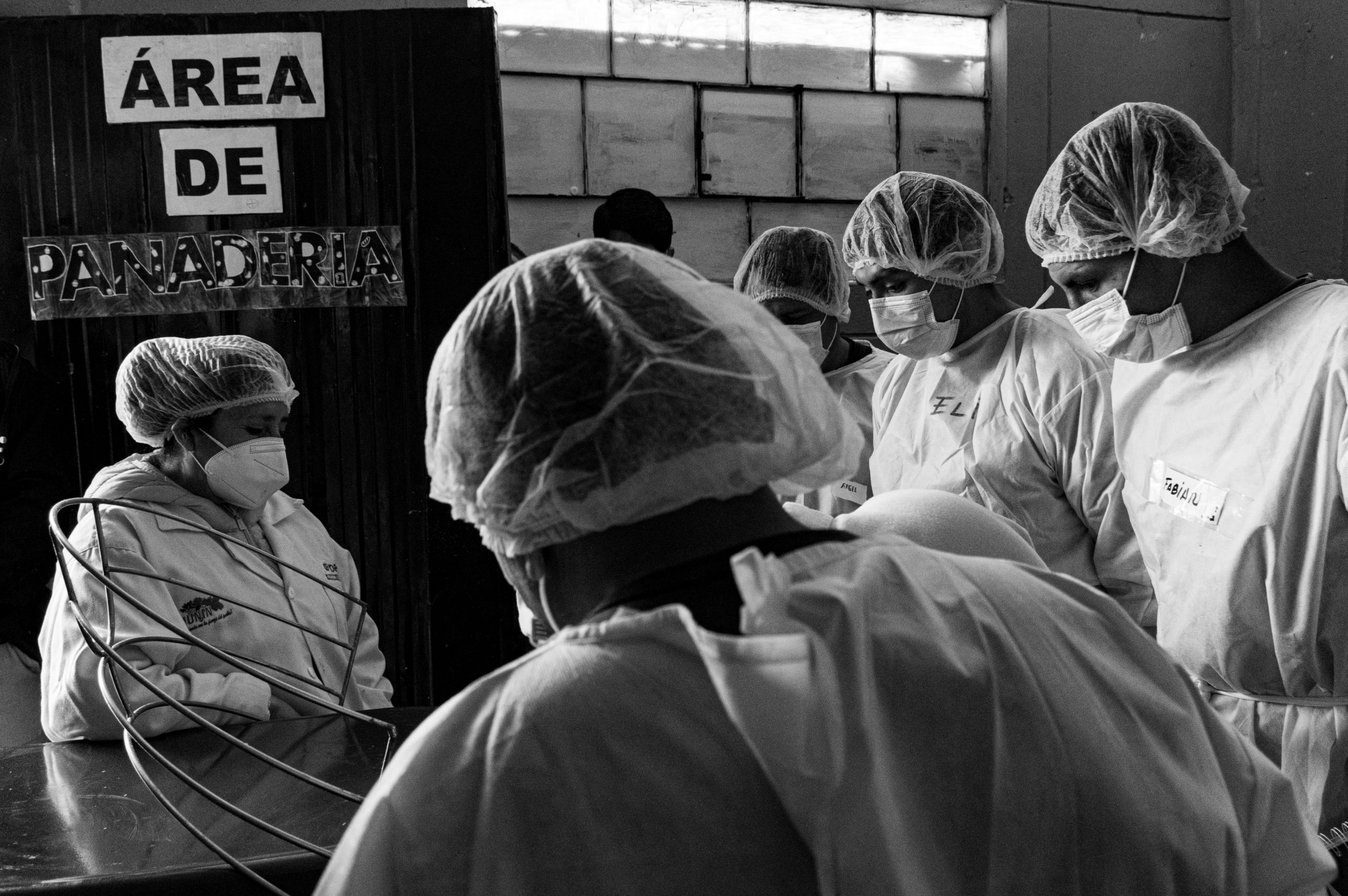 a black and white photo of a group of doctors