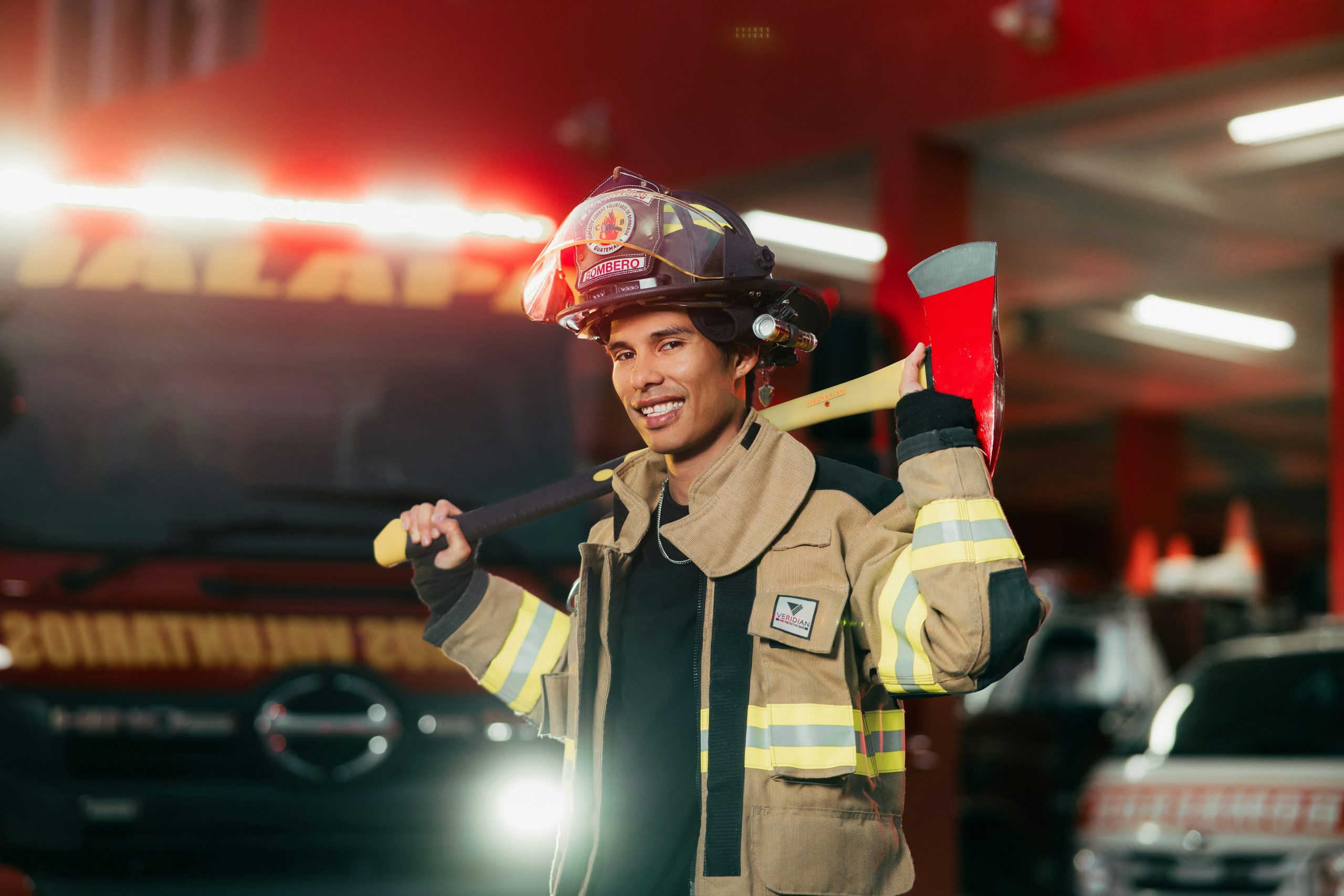 unsplash-sc2oolcazey A firefighter standing in front of a fire truck